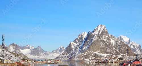Panoramic view of snow mountain and fisherman village..