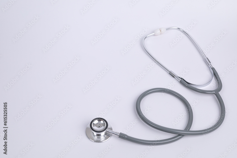 Close Up Gray stethoscope on white background for doctor and medical nursing people check up healing of patients in hospital. healthcare concept. space, background for advertisement. Close Up Gray stethoscope on white background for doctor and medical nursing people check up healing of patients in hospital. healthcare concept. space, background for advertisement.