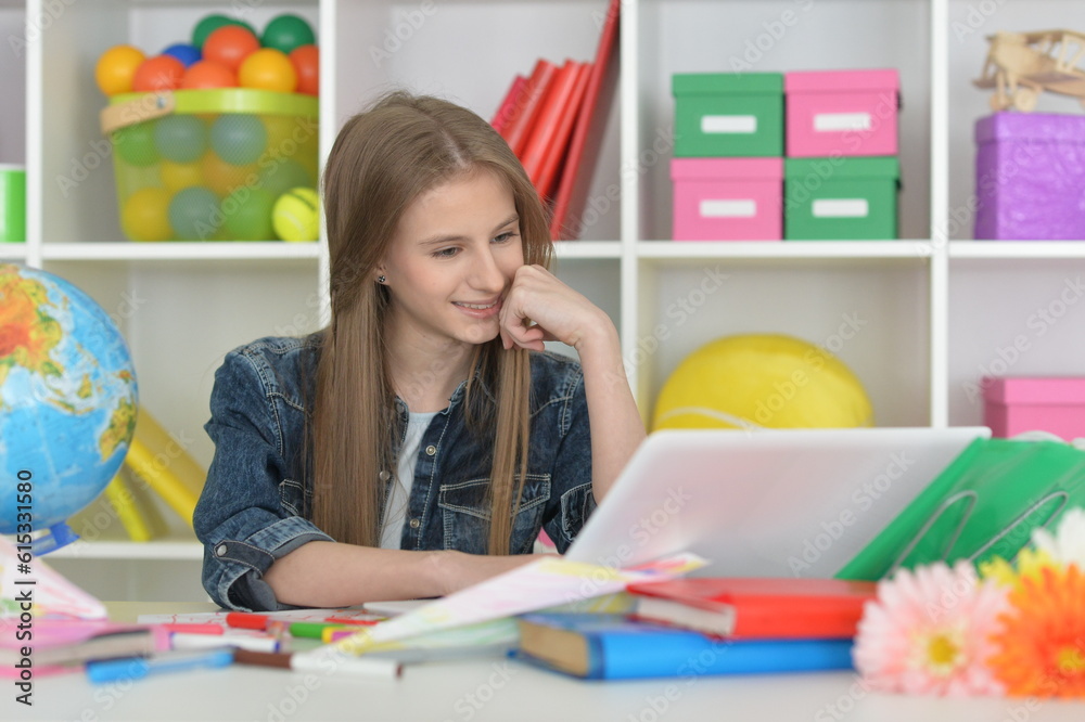 cute girl with laptop at home at desk cute girl with laptop at home at desk