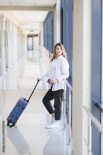 Pretty young female passenger at the airport