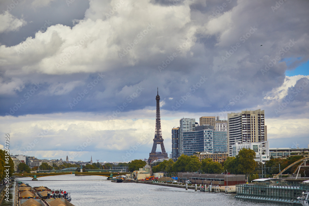 Eiffel tower over the river Seine from Garigliano bridge on a bright fall day in Paris, France