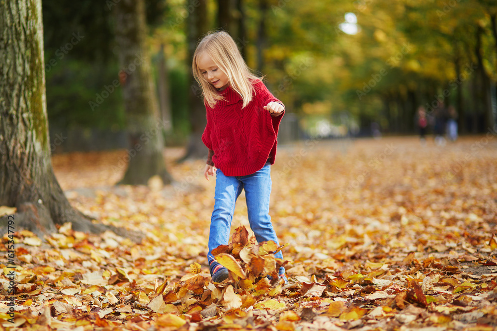 Adorable preschooler girl walking on a fall day Adorable preschooler girl walking on a fall day