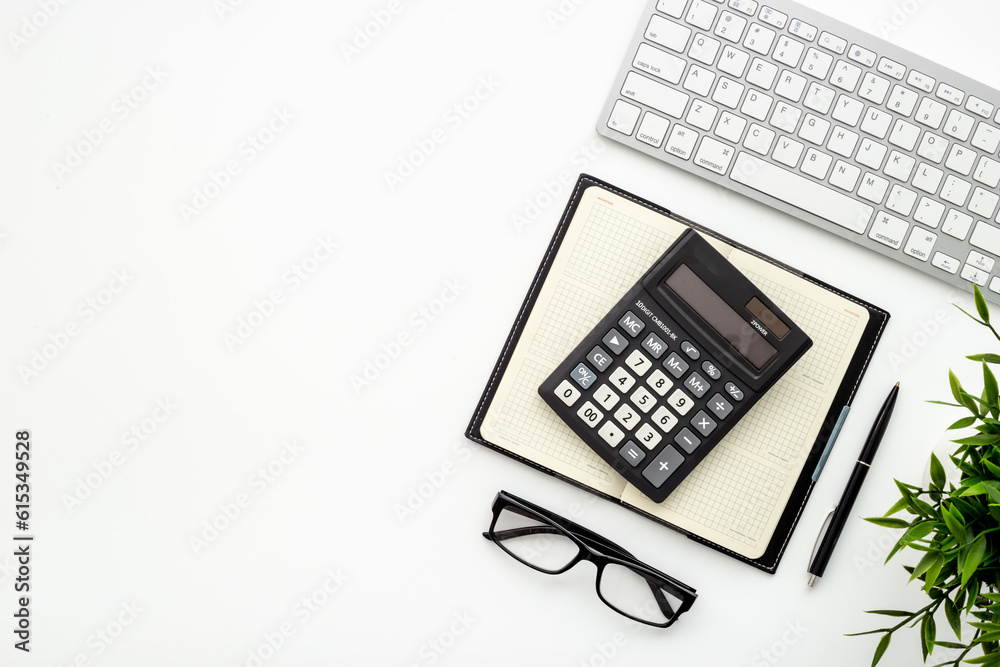 Office table with financial accounting and business planning with calculator Office table with financial accounting and business planning with calculator