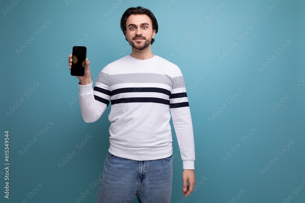 charming positive 30s man in red shirt holding phone screen forward charming positive 30s man in red shirt holding phone screen forward