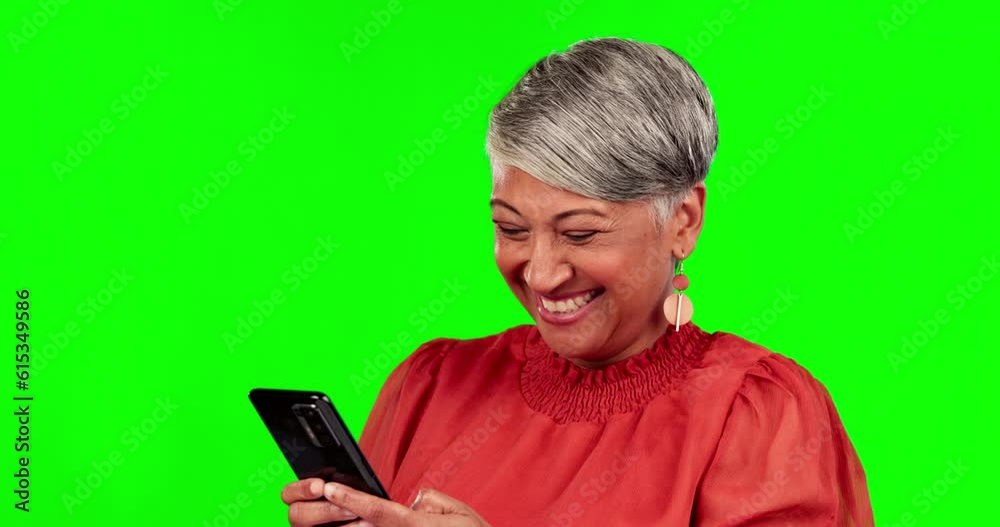 Phone, happy and senior woman on green screen for conversation, chatting and mobile app. Communication, network and female person typing on smartphone for social media, internet and email in studio