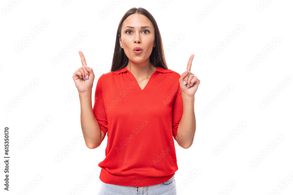 young inspired caucasian brunette woman in a red short sleeve shirt points with her hands to the sides young inspired caucasian brunette woman in a red short sleeve shirt points with her hands to the sides