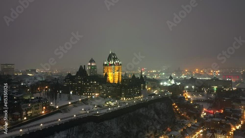 Aerial drone hyperlapse of Old Quebec in Quebec, Canada on a winter night with snow photo