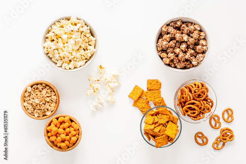 Many bowls of snacks for party - chips popcorn and nuts