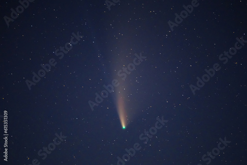 closeup comet on the night starry sky background