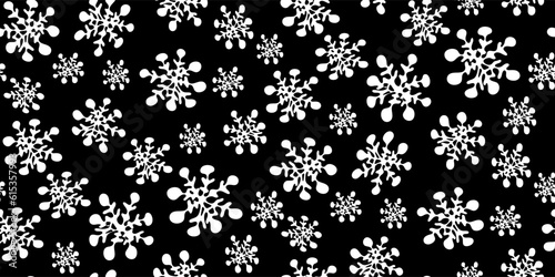 Christmas seamless pattern with white silhouettes of snowflakes in childlike naive scribble style on black. For greeting card, gift packaging., wrapping paper.