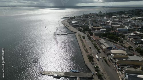 Aerial over the waterfront and city of Santarém, State of Pará, Brazil. Drone dolly forward shot photo