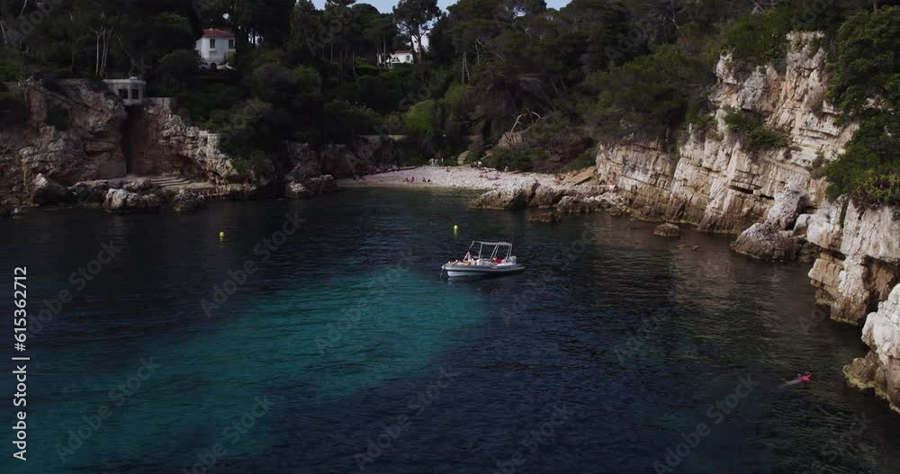 Boat on Hidden Beach Cove on Antibes Paradise Coastline, South of France - Aerial