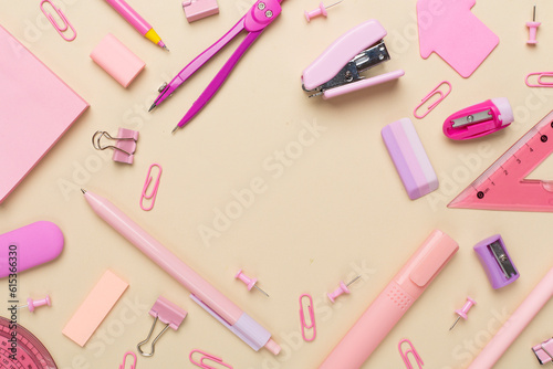 Pink school stationery on color backgroung, top view