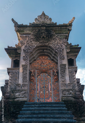 Balinese hindu temple entrance gate. Indonesian architecture of holly places  ancient bali carved stone temple with entrance steps