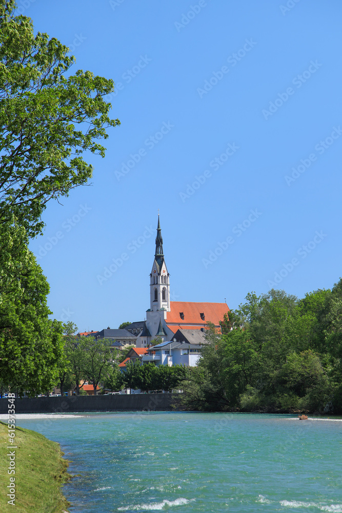 View at river Isar in Bad Tölz with the Church of the Assumption of Mary (Mariä Himmelfahrt) in background, Bavaria - Germany
