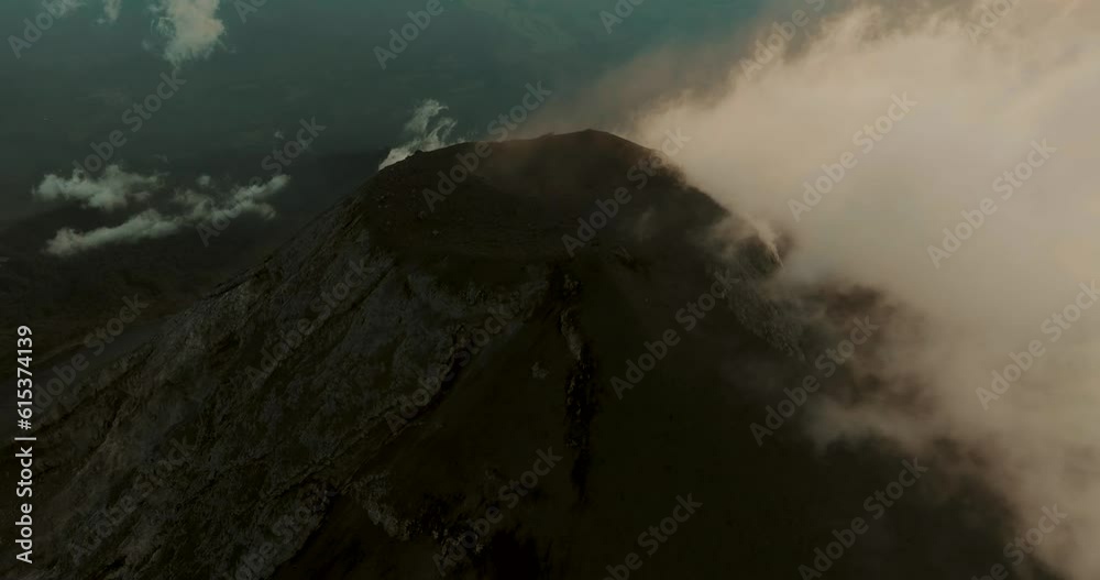 Clouds Of Smoke From The Crater Of Fuego Volcano In Antigua, Guatemala. aerial tilt-up