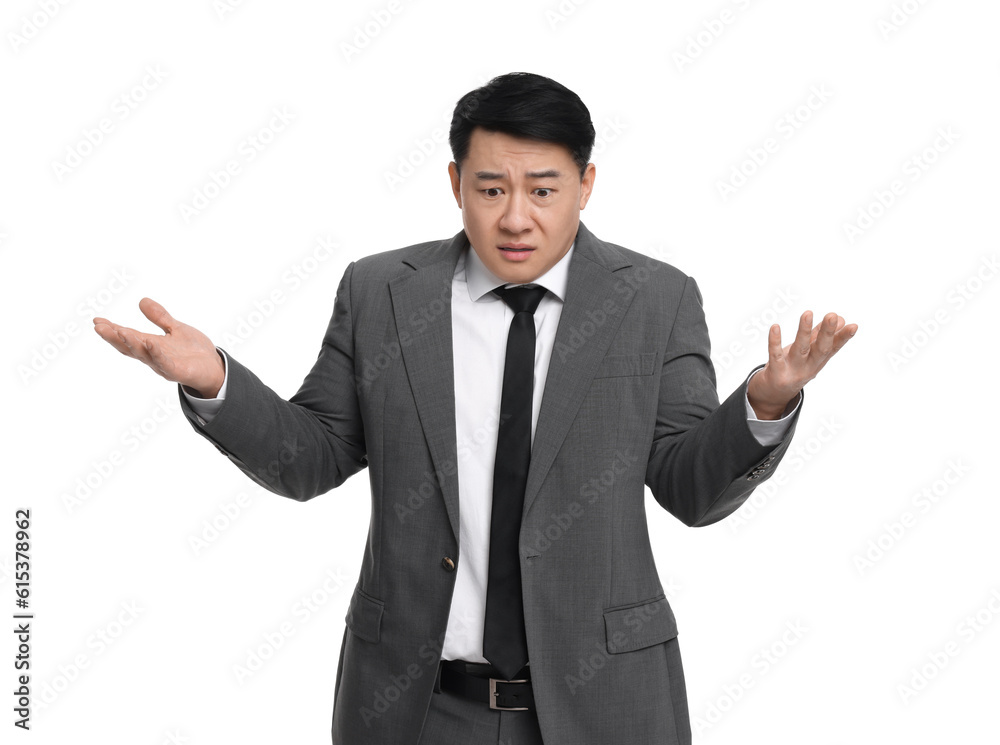 Confused businessman in suit posing on white background Confused businessman in suit posing on white background