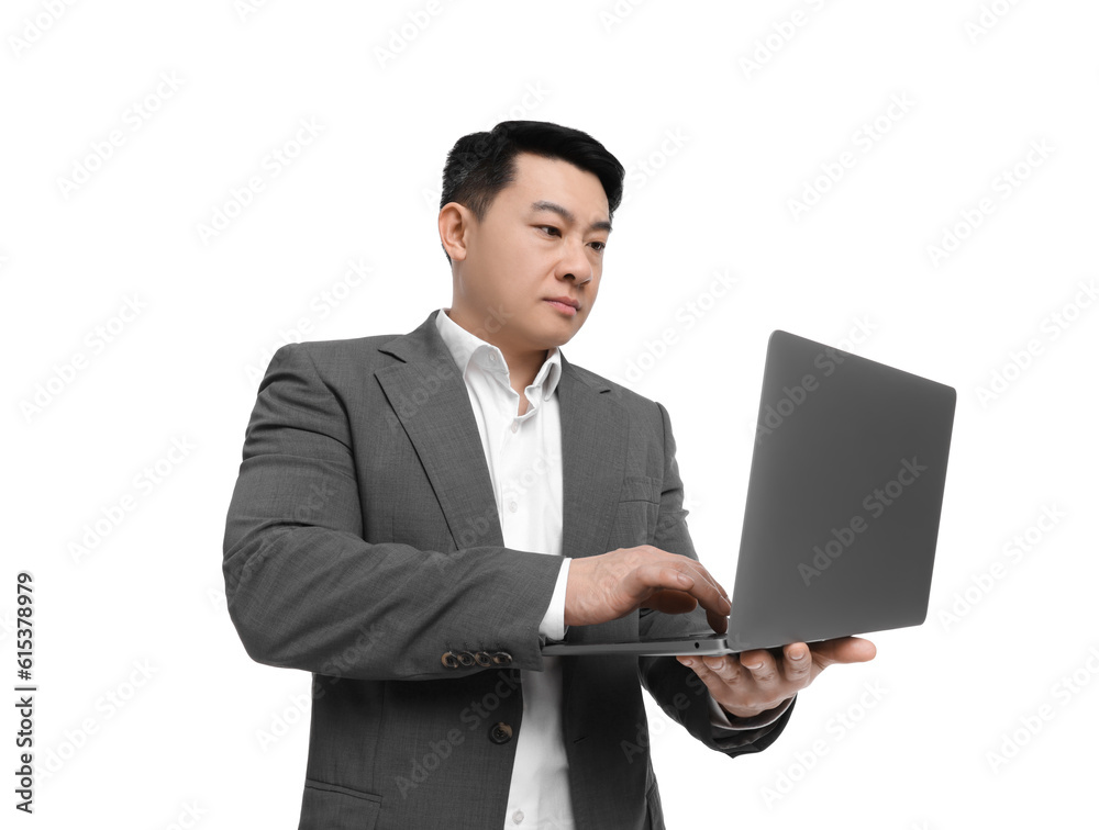 Businessman in suit working on laptop against white background Businessman in suit working on laptop against white background