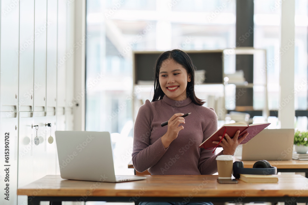 Young student studying in classroom at college. Student working at background. education, back to school concept Young student studying in classroom at college. Student working at background. education, back to school concept