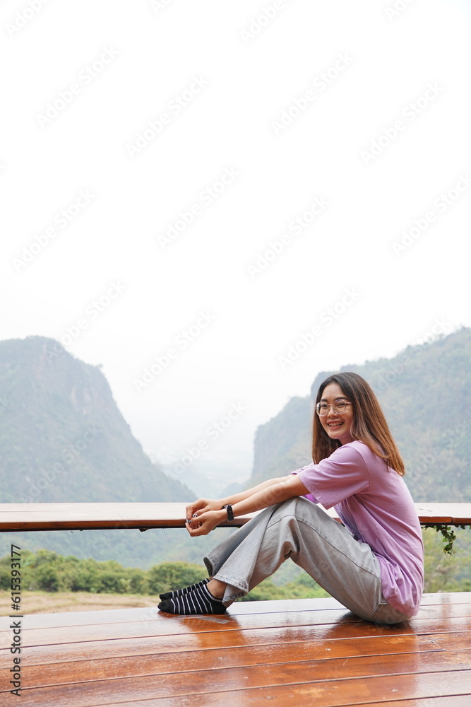 Portrait of smiling woman with mountain view, people with landscape concept.