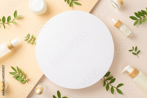 Herbal cosmetics concept. Top view photo of empty circle surrounded by cosmetic products  eucalyptus foliage on isolated two-toned beige background with copyspace