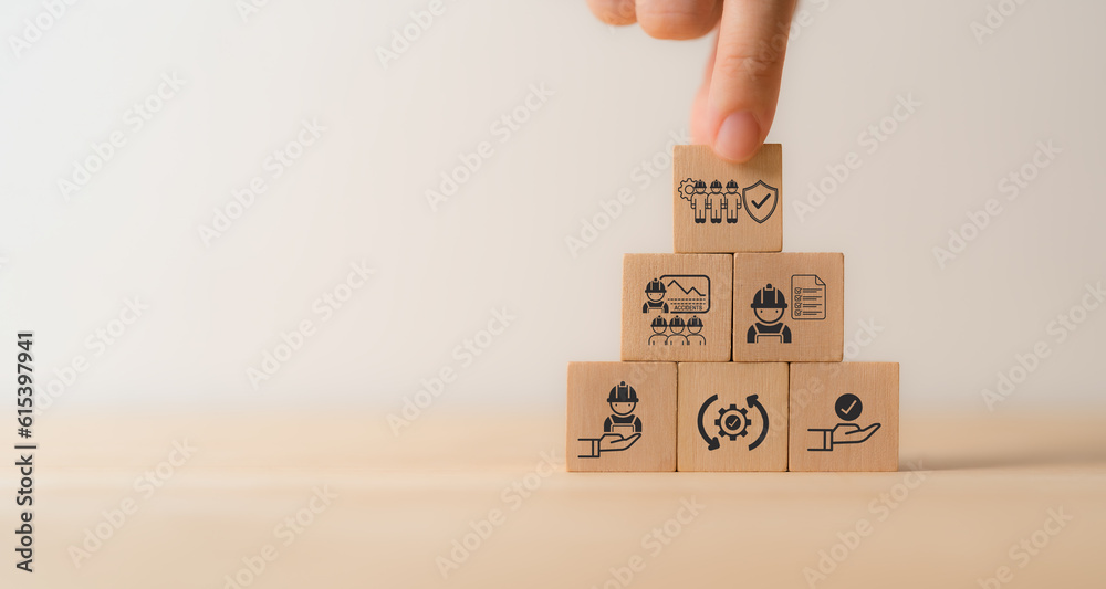 Work safety concept. Wooden cube blocks with icon of safety at workplace surrounded by safety first, protections, health, regulations and compliance. Working standard process. Zero accidents. Work safety concept. Wooden cube blocks with icon of safety at workplace surrounded by safety first, protections, health, regulations and compliance. Working standard process. Zero accidents.