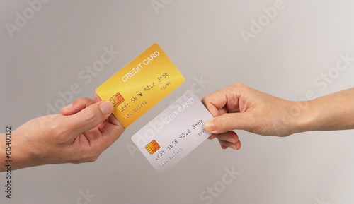 Two hands is hold black and gold credit card on white background..