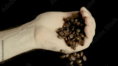 Spilling Coffee Beans From Hand In Slow Motion