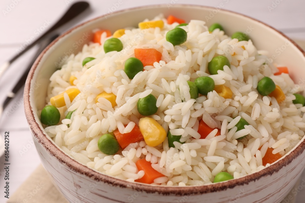 Delicious rice with vegetables in bowl, closeup Delicious rice with vegetables in bowl, closeup