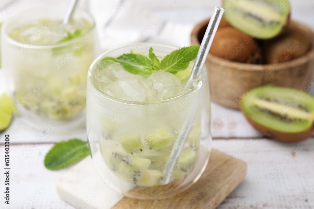 Refreshing drink with kiwi and mint on white table, closeup Refreshing drink with kiwi and mint on white table, closeup