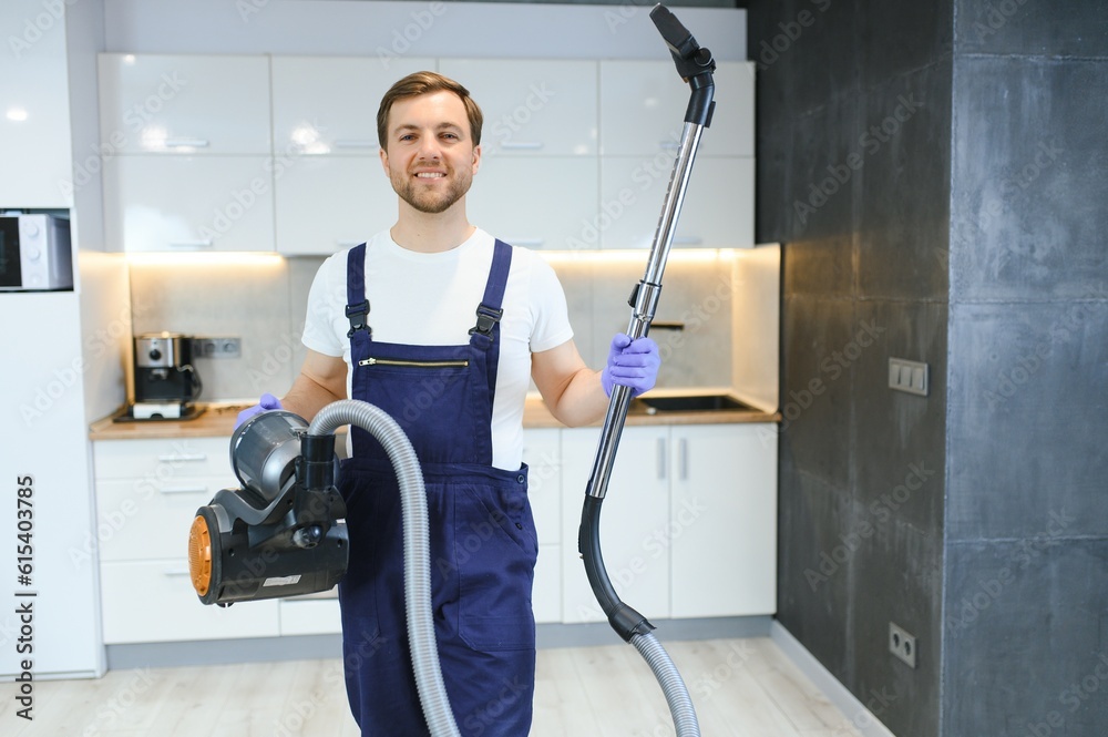 Man cleaning in the flat with vacuum cleaner Man cleaning in the flat with vacuum cleaner
