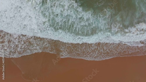 South Africa Still Bay empty beach aerial drone cinematic beach small surf town Garden Route Jeffreys Bay  waves crashing aqua blue green ocean late morning afternoon top down left movement photo