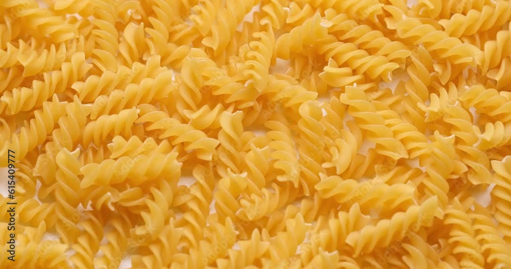 pasta backgroud - macro view of Dry Authentic Italian fusilli pasta backgroud - macro view of Dry Authentic Italian fusilli