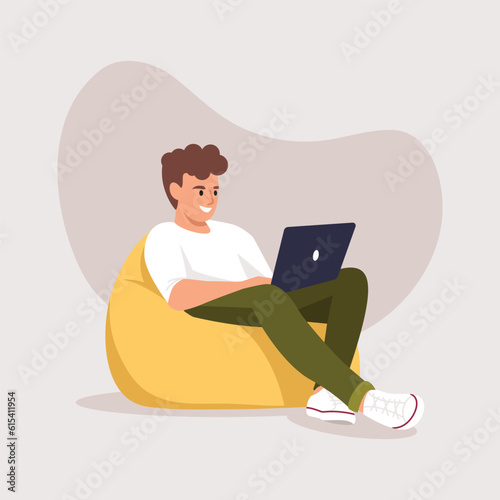 man sitting on a bag chair with a computer