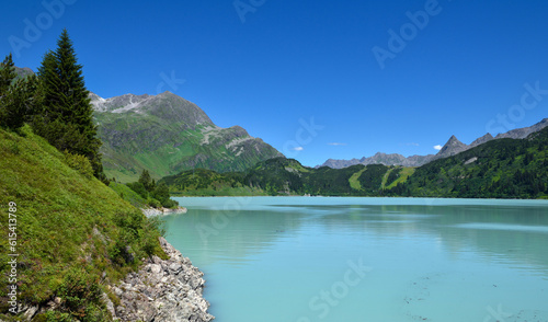 Reservoir lake with mountains epic landscape. Idyllic reservoir Kops lake at 1800 m in austrian Galtur, Vorarlberg