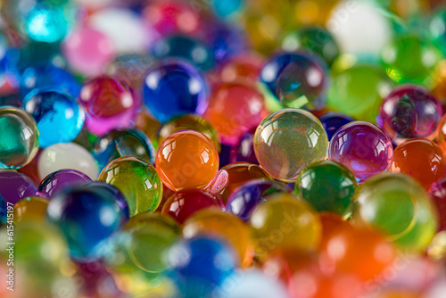 Water beads close-up, abstract background. Texture of Hydrogel balls or many colorful orbeez for wallpaper.