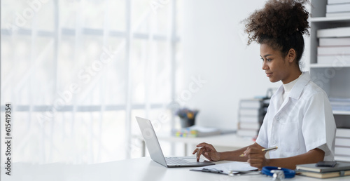 african american woman doctor studying Learn about medical information. and all professions in documentation and research. researching content on laptop computer copy space, banner, panorama.