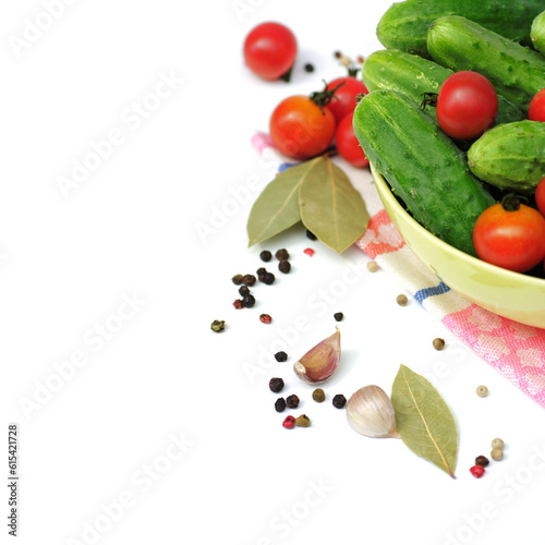 Canning vegetables. Fresh cucumbers and tomatoes isolated on white background.