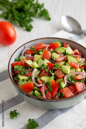 Homemade Mediterranean Cucumber Tomato Salad in a Bowl, side view.