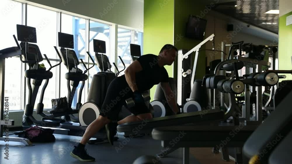 Man in the gym with weight Man in the gym with weight