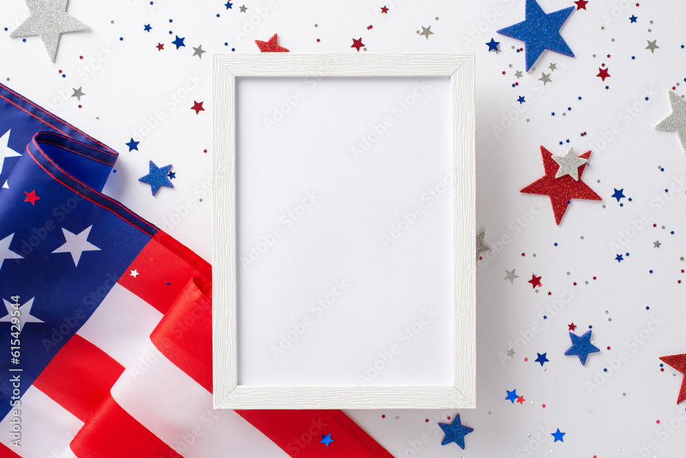 Fototapeta premium Labor Day in USA concept. Above view photo of empty wooden frame surrounded by white, blue and red star-shaped sparkles and american flag on white isolated background with copy-space