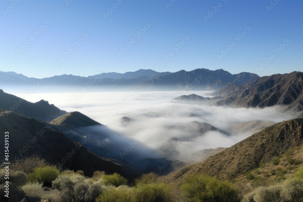 panoramic view of mist-shrouded mountains, bordered by a blue sky, created with generative ai