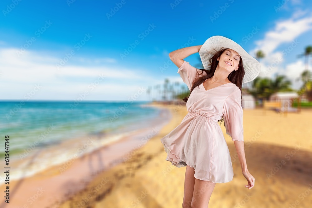 Stylish attractive young woman on warm beach Stylish attractive young woman on warm beach
