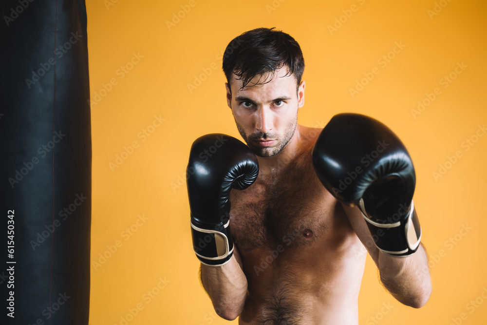 Strong male boxer standing in boxing gloves Strong male boxer standing in boxing gloves