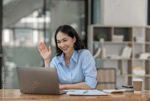 Wallpaper Mural Asian businesswoman working on laptop Online document database, analyzing financial reports Data recording and document management system concepts. Automate actions to manage files efficiently. Torontodigital.ca