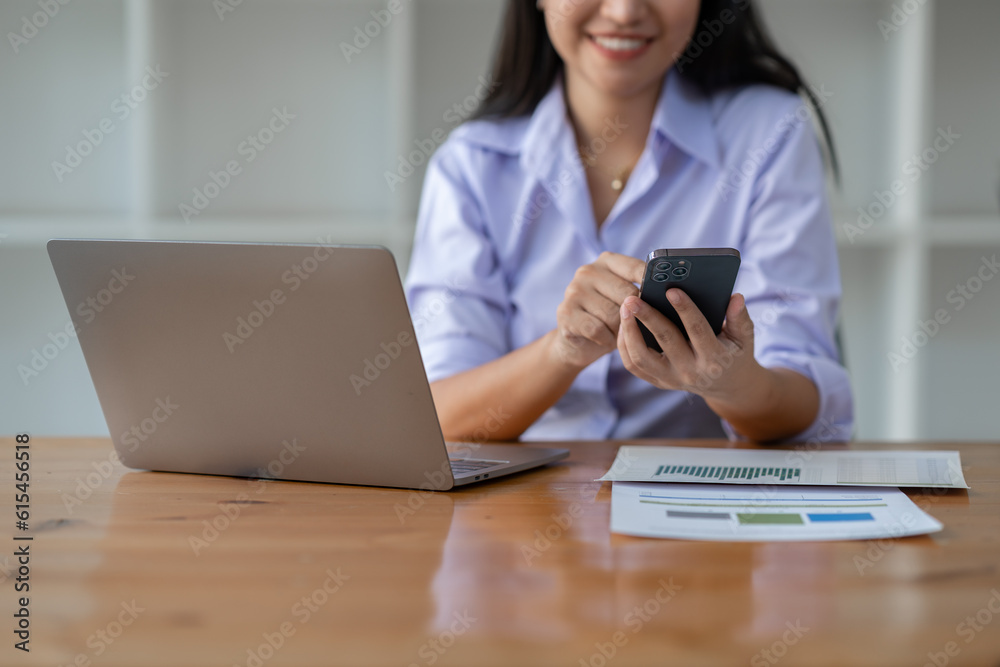Confident businesswoman working using mobile phone to search for information Talk through an application about financial investments in real estate business projects. management system concept. Confident businesswoman working using mobile phone to search for information Talk through an application about financial investments in real estate business projects. management system concept.