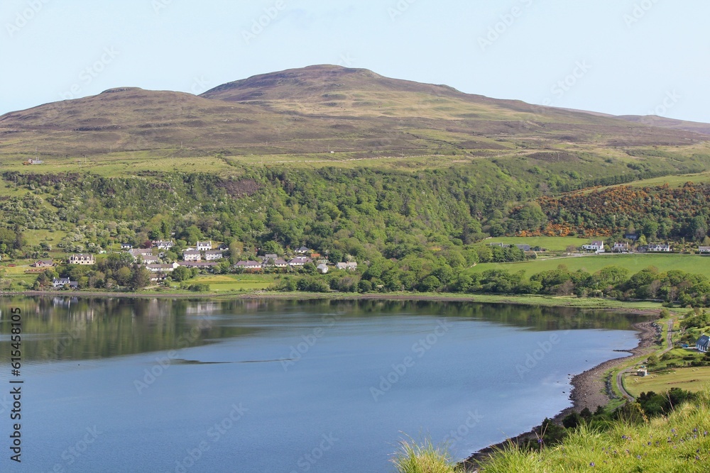 A spectacular view of the Isle of Skye and its rugged coastline of cliffs on a sunny blue sky summer day