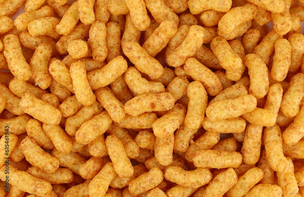 Puffed peanuts and corn snacks. Background and texture, full frame. Puffed peanuts and corn snacks. Background and texture, full frame.