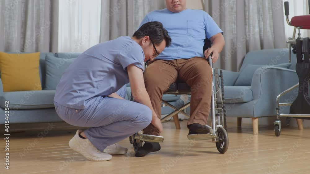 Asian Male Nurse Helping A Patient In Wheelchair Putting Feet On Footrest After A Physical Therapy At Home
Asian Male Nurse Helping A Patient In Wheelchair Putting Feet On Footrest After A Physical Therapy At Home