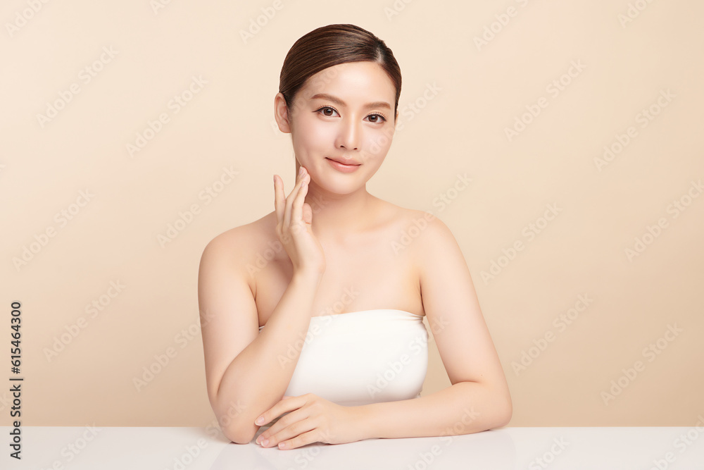 Beautiful young asian woman with clean fresh skin on beige background, Face care, Facial treatment, Cosmetology, beauty and spa, Asian women portrait. Beautiful young asian woman with clean fresh skin on beige background, Face care, Facial treatment, Cosmetology, beauty and spa, Asian women portrait.